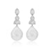 Pair of earrings with teardrop-shaped pearls and diamond-like stones on a white background